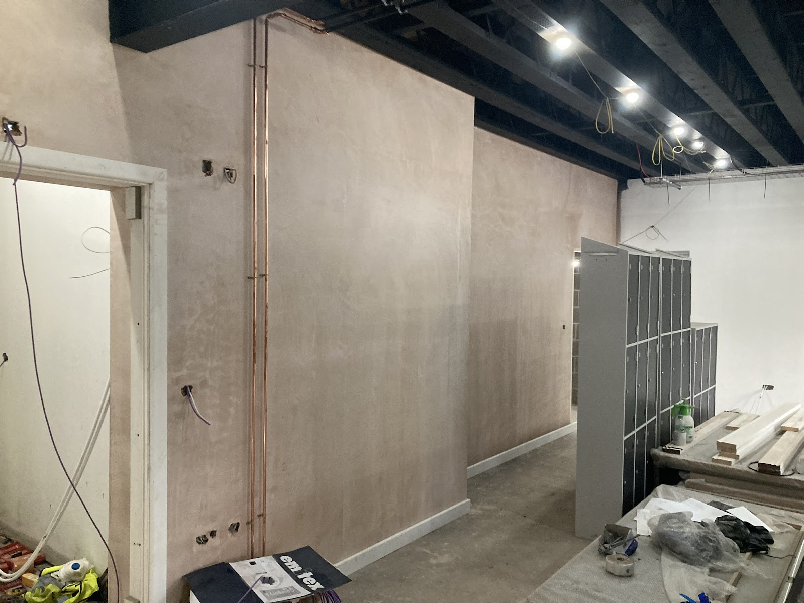 Freshly plastered walls on a larger fit-out project by the team